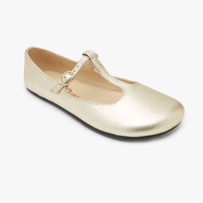 The Women's T Strap Color barefoot flat Gold in a white background 1