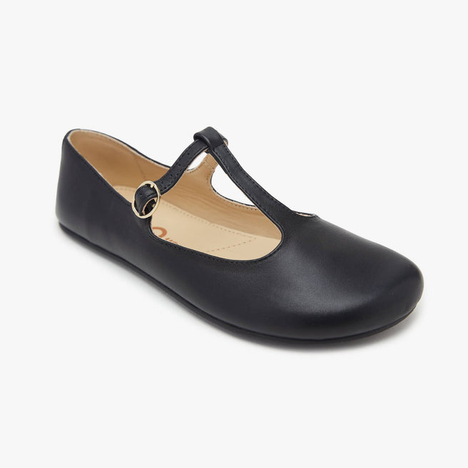 The Women's T Strap Color barefoot flat Black in a white background 1