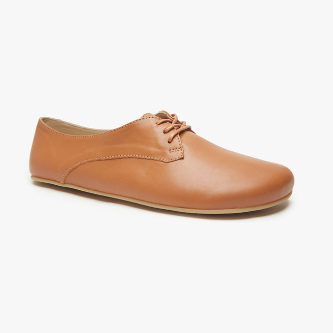 Camel tan leather Women's Derby by Origo, angled three-quarter view of a single lace-up flat with gum sole.