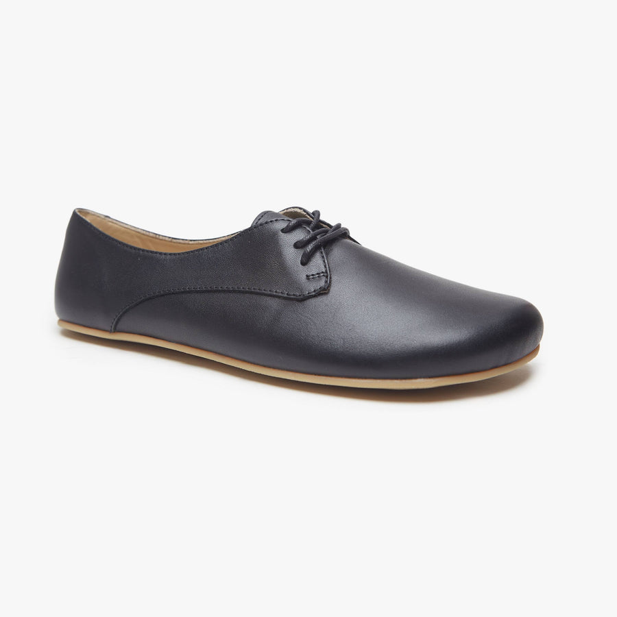 Black leather Women's Derby by Origo, angled three-quarter view of a single lace-up shoe with gum sole.