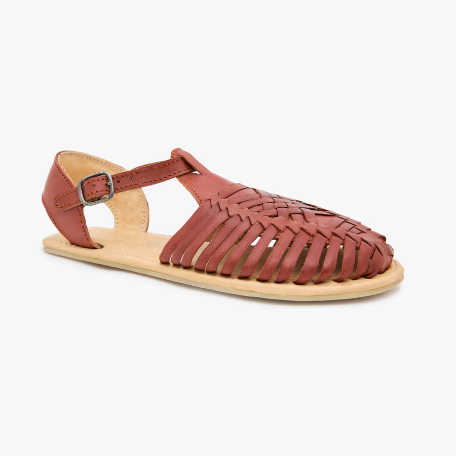 Cinnamon brown woven leather Huarache Sandal by Anya with T-strap and ankle buckle, angled three-quarter view.