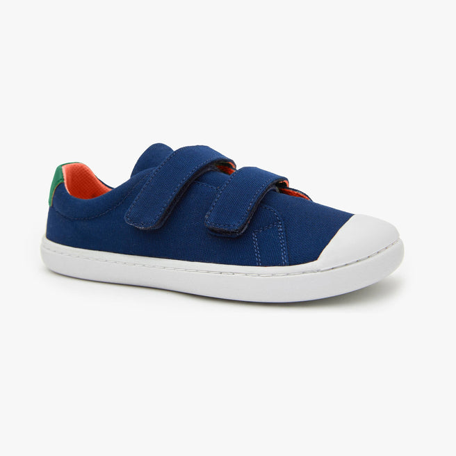 Navy cotton canvas Kid's Hook & Loop sneaker by Origo with two straps and white sole, angled side view.