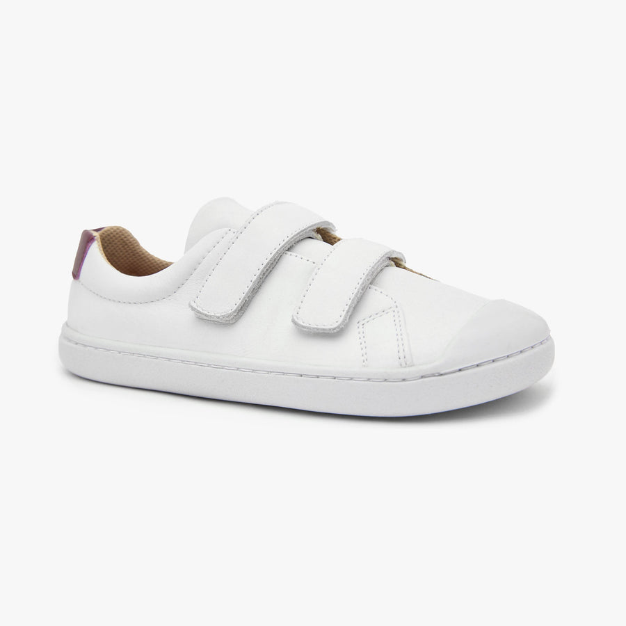 White natural leather Kid's Hook & Loop sneaker by Origo with two straps and white sole, angled side view.