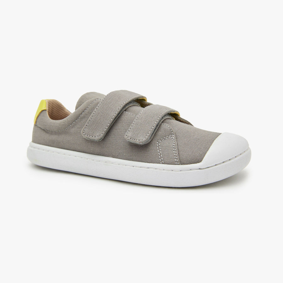 Grey cotton canvas Kid's Hook & Loop sneaker by Origo with two straps and white sole, angled side view.