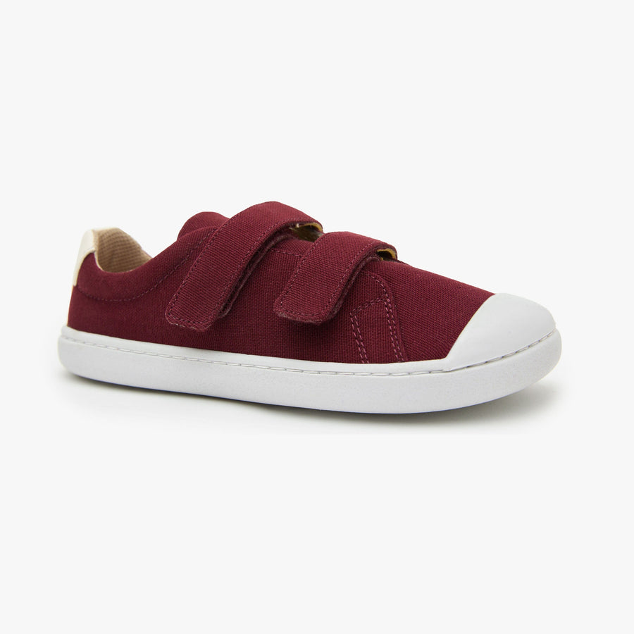 Burgundy cotton canvas Kid's Hook & Loop sneaker by Origo with two straps and white sole, angled side view.