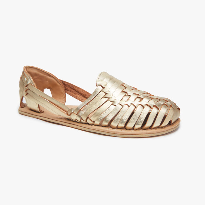 Metallic gold woven leather Huarache Slip-On by Anya, angled three-quarter view of a single closed shoe.