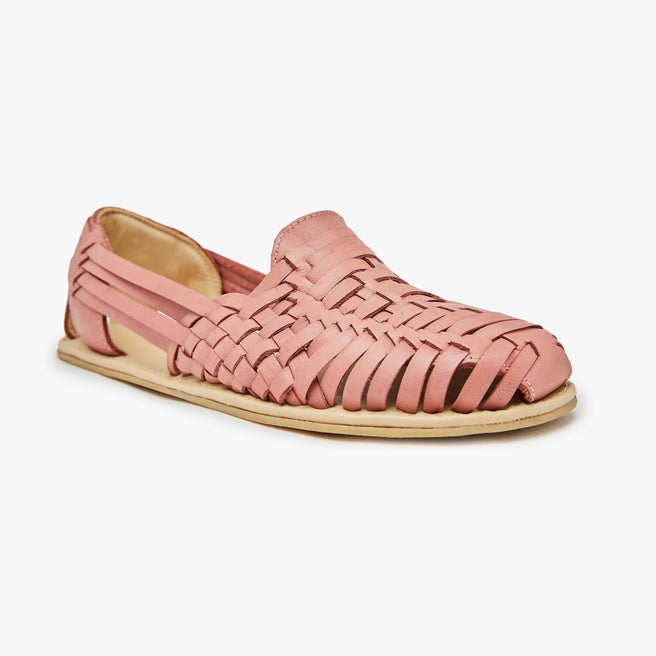 Coral pink woven leather Huarache Slip-On Wide by Anya, angled three-quarter view of a single closed shoe.
