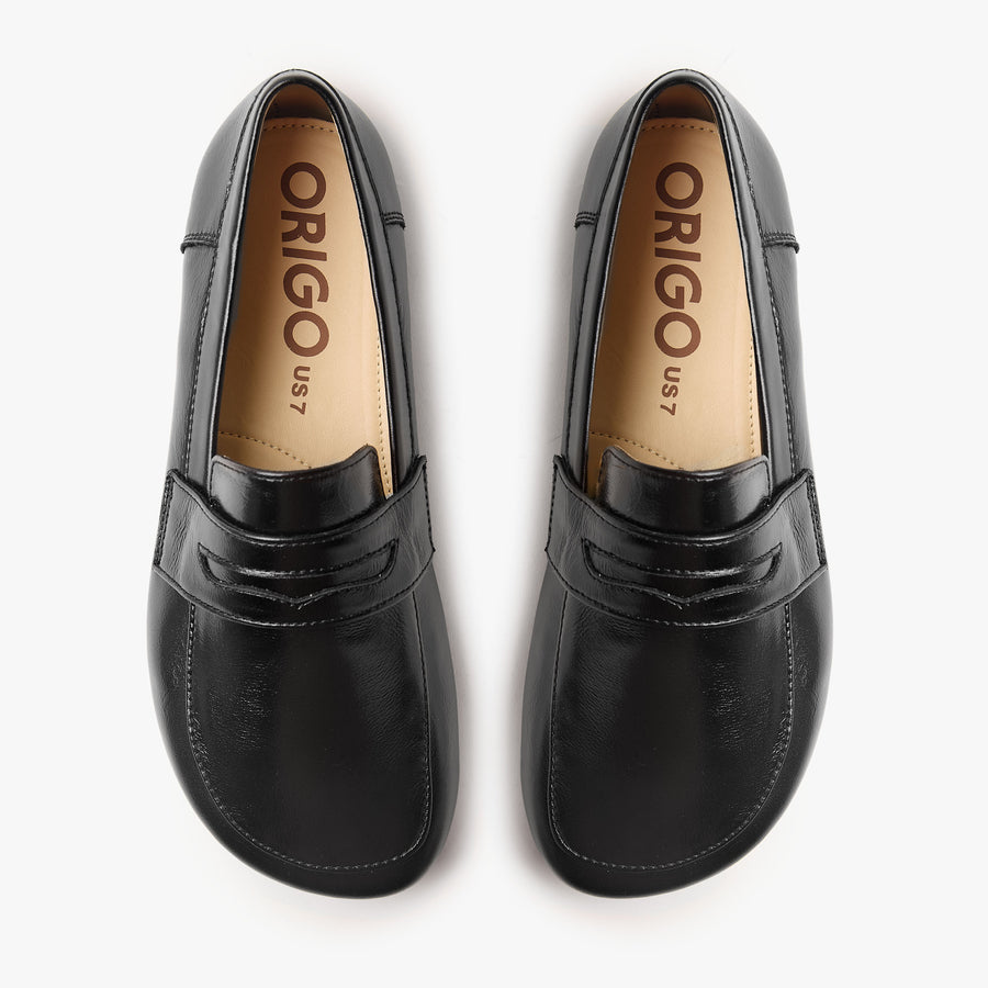 Origo Women's Penny Loafer, Patent Black - top-down view of the pair