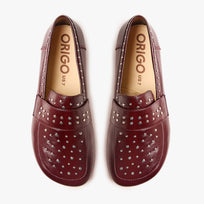 Origo Women's Penny Loafer, Studded Patent Burgundy - top-down view of the pair