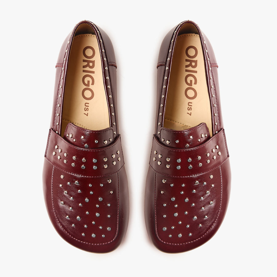Origo Women's Penny Loafer, Studded Patent Burgundy - top-down view of the pair